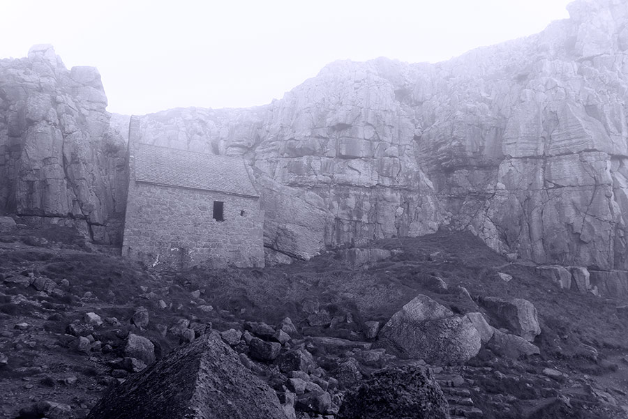 atmospheric black and white photograph of St. Govan's Chapel Pembrokeshire by Mark Lloyd Williams