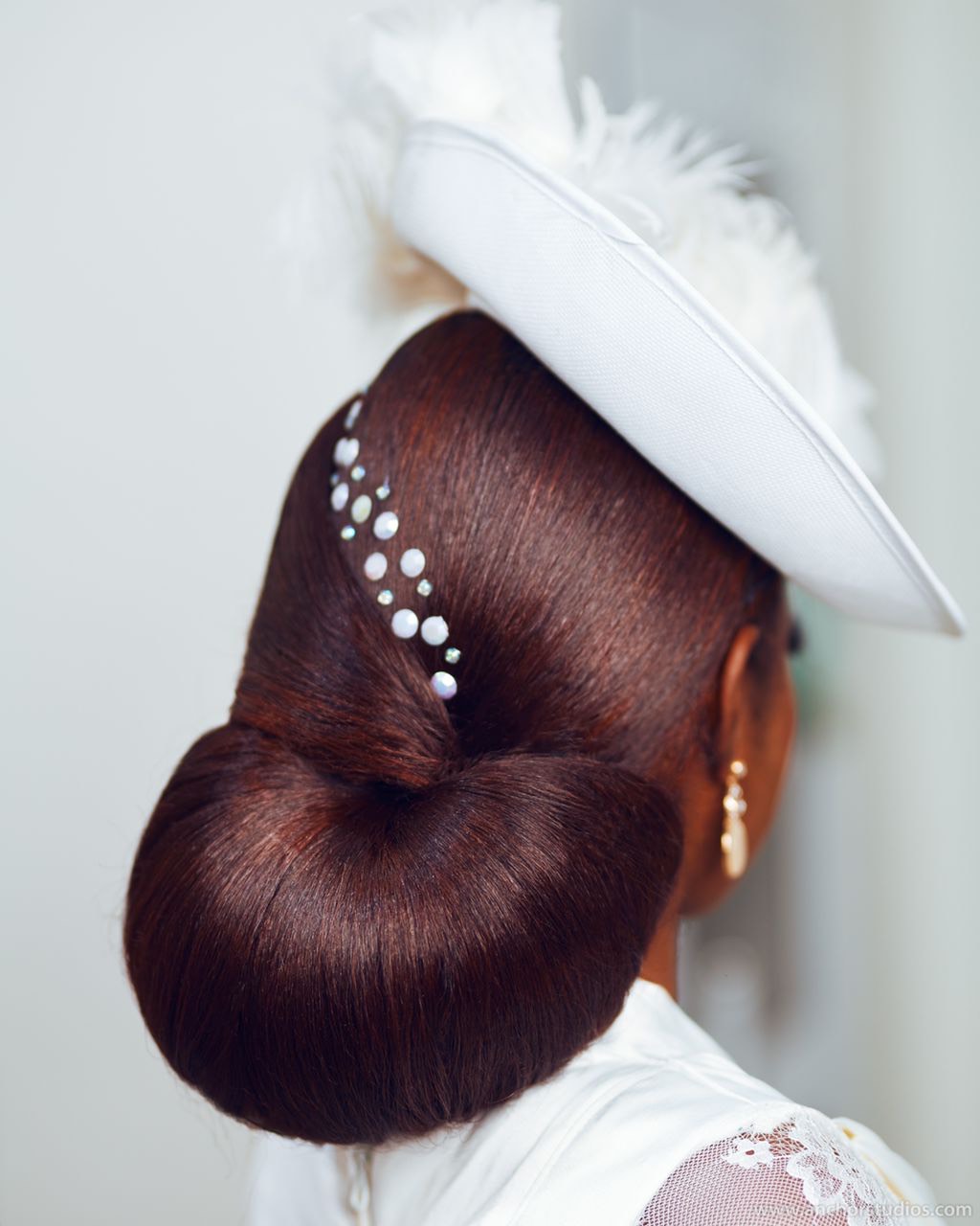 a smiling baby wearing a white shirt