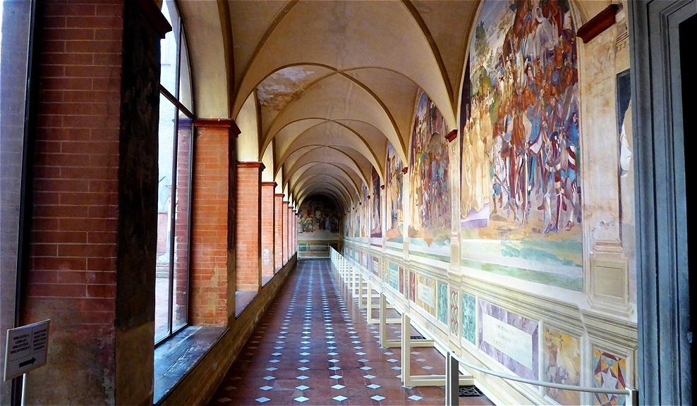 Der Kreuzgang mit den berühmten Fresken von Luca Signorellis und Sodomas
Begonnen wurde der Zyklus 1497 von Luca Signorelli