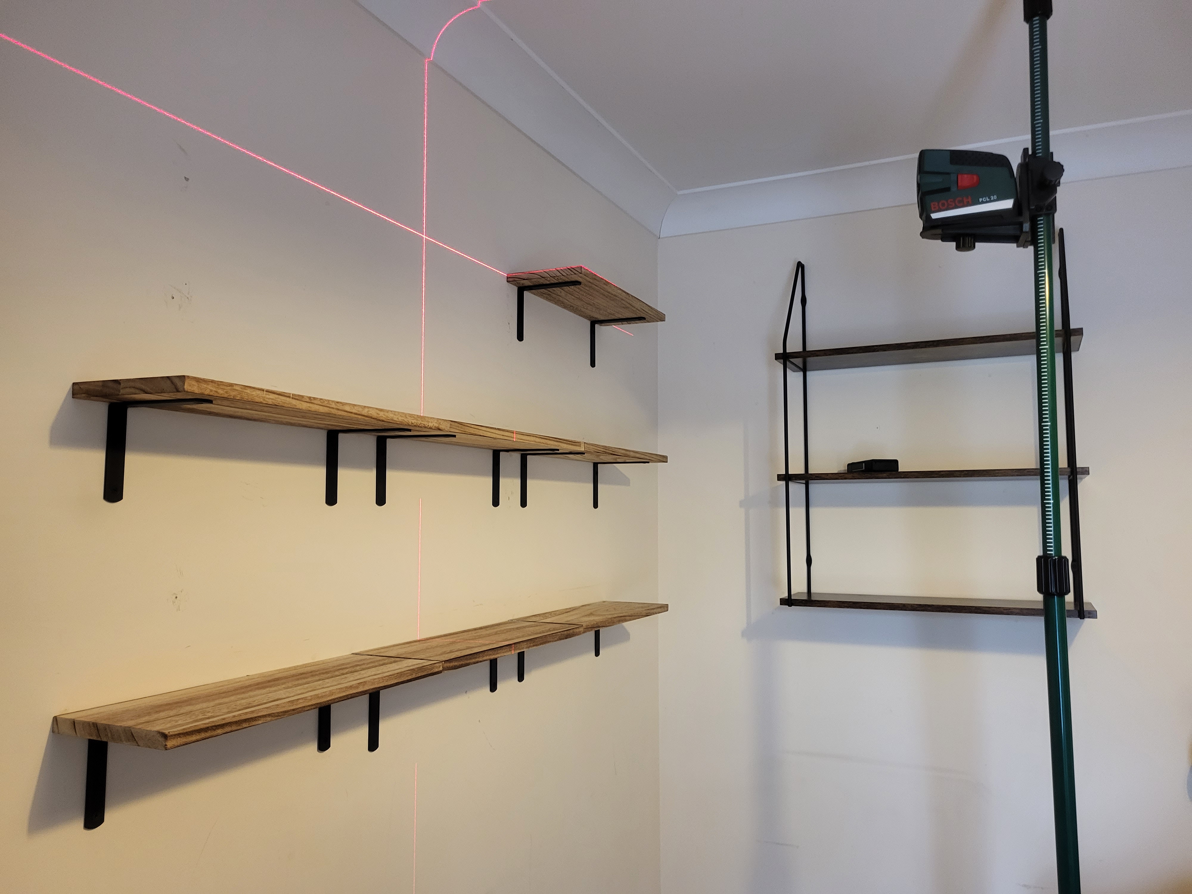 Hanging pictures and straightening shelves