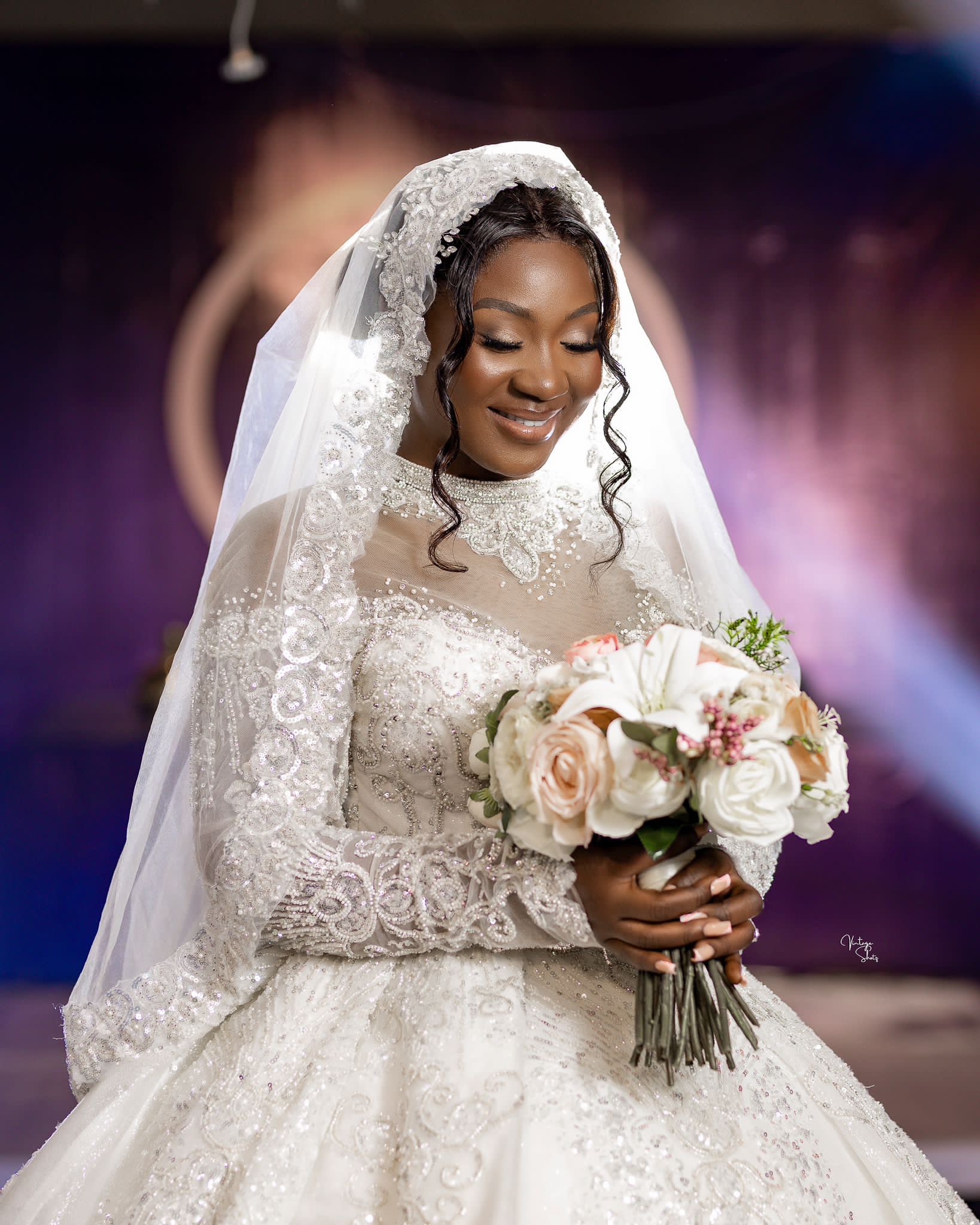 a smiling baby wearing a white shirt