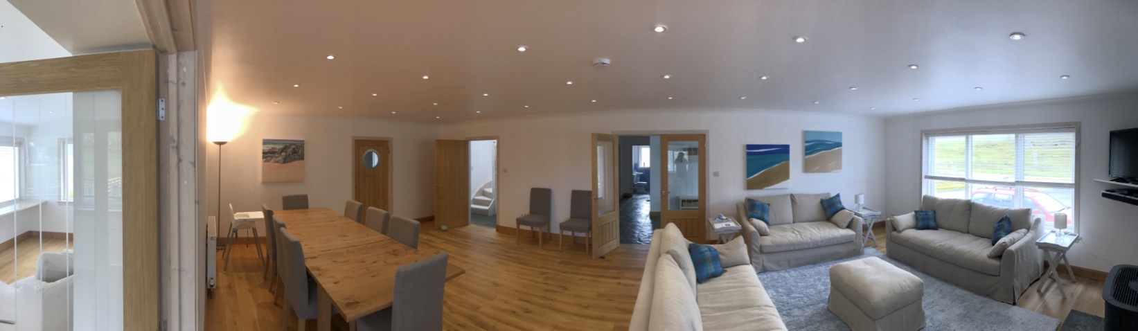 Main living room with sitting area and dining area.