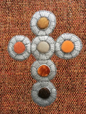 Modern lectionary cover with a ploy-lobed cross