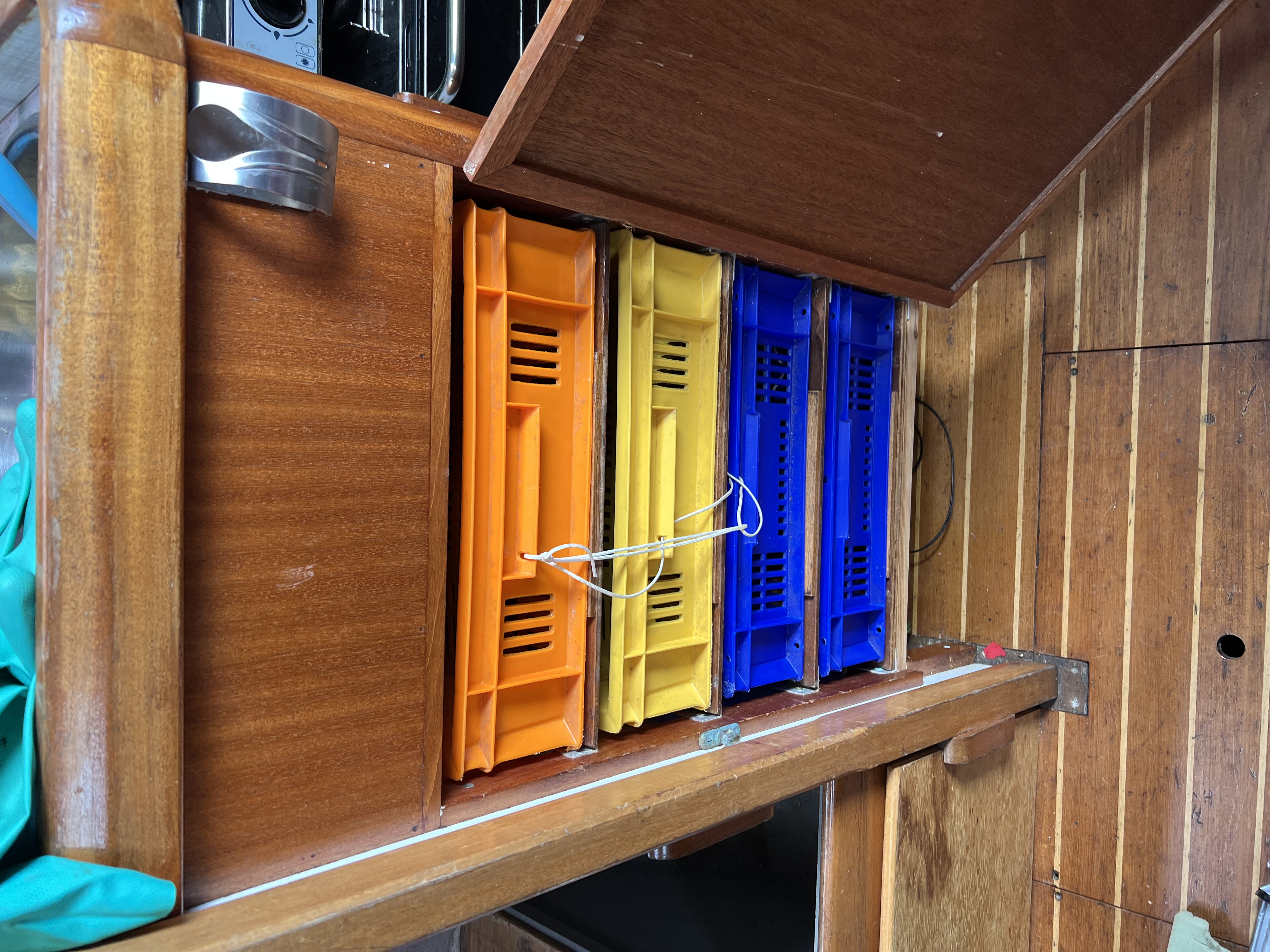 Storage boxes under galley