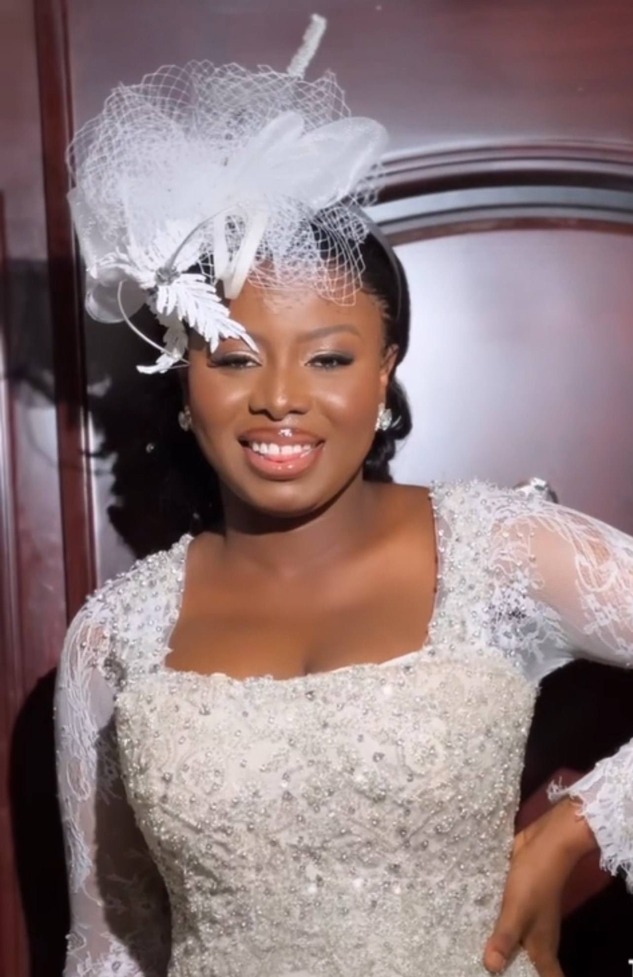 a smiling baby wearing a white shirt