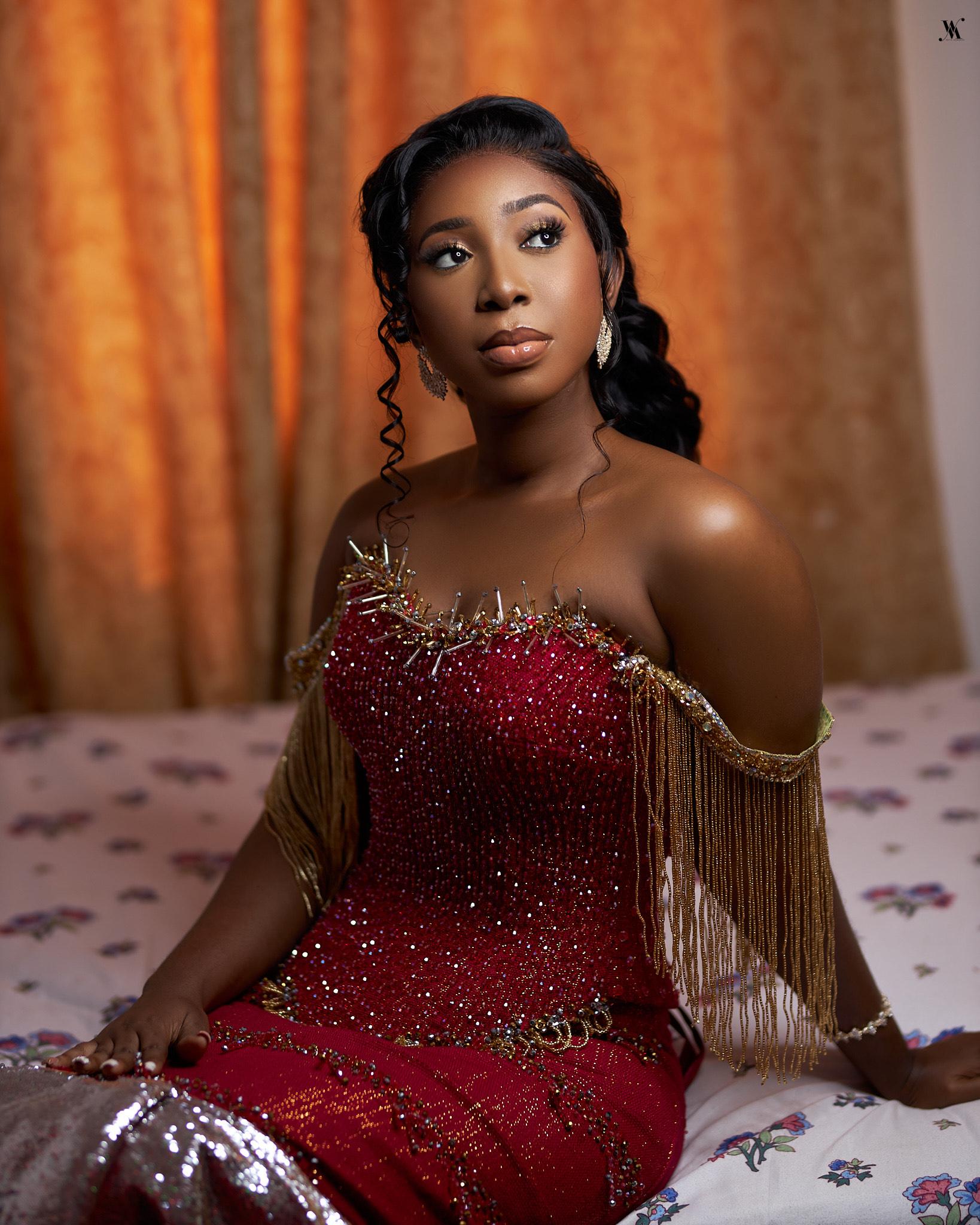 a man with dreadlocks sitting at a table