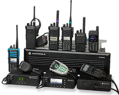 Collection of Motorola two-way radios and accessories including walkie-talkies and communication devices.